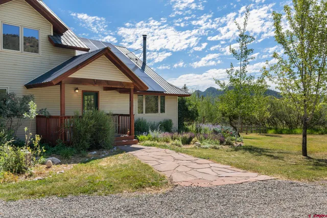 a view of a balcony with two chairs