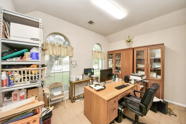 a view of a workspace with furniture