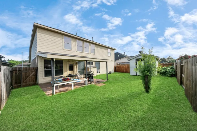 a front view of a house with garden and porch