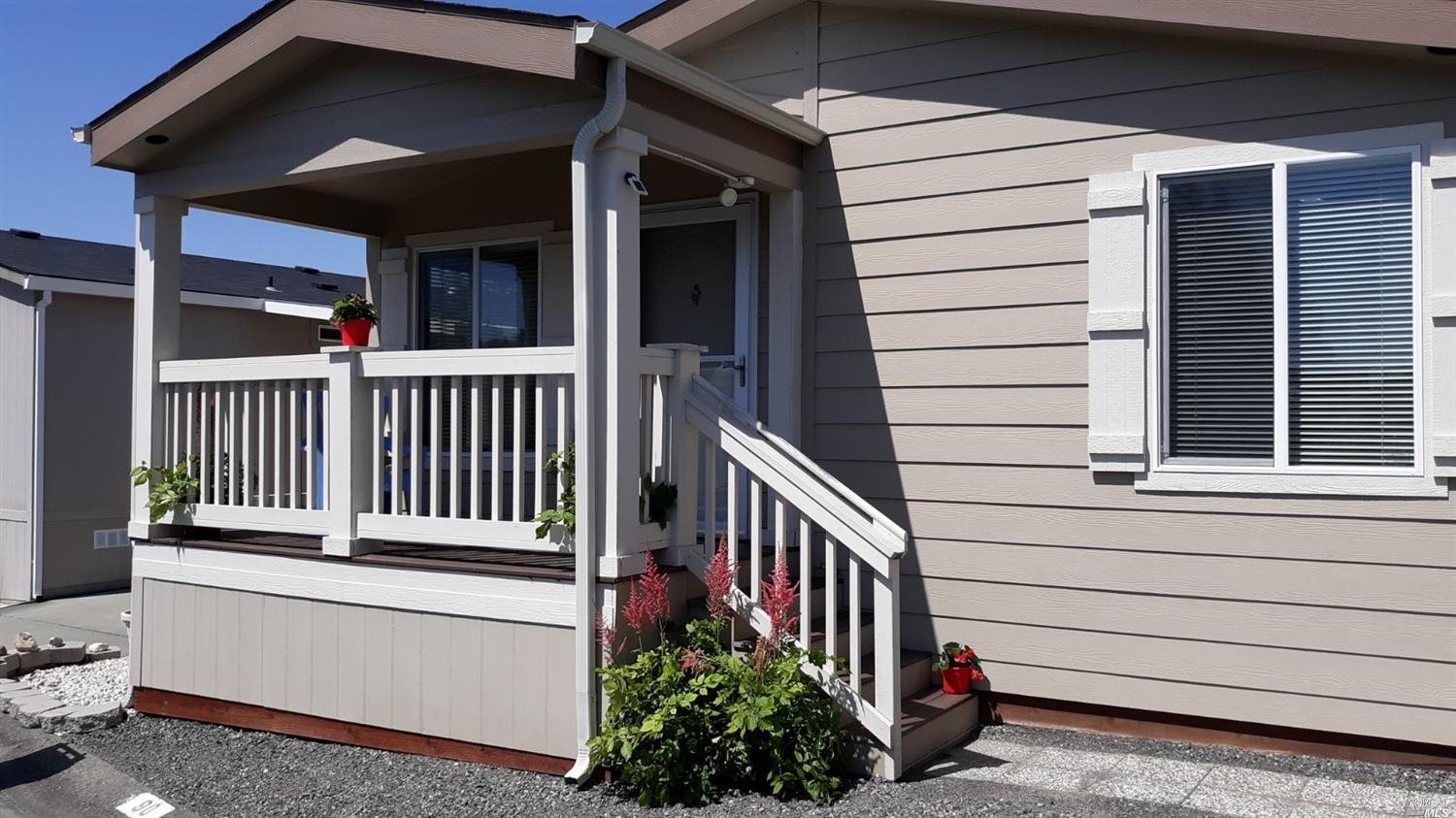 90 Redwing Drive, Unit 90 Santa Rosa, CA 95409 - Photo 1 of 1 a view of a house with a small yard and wooden floor and fence