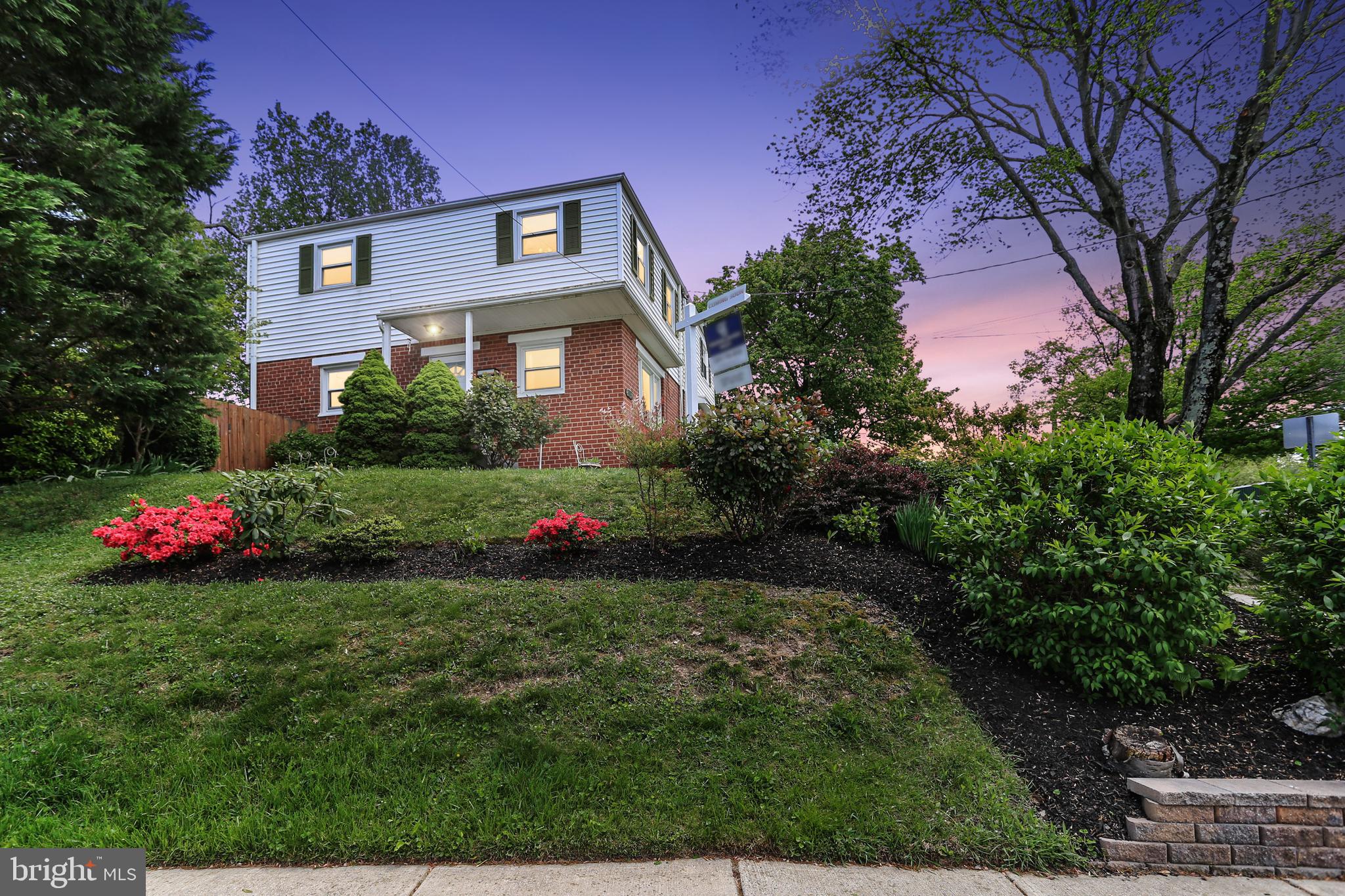 3115 Medway Street Silver Spring, MD 20902 - Photo 1 of 43 a front view of a house with plants and garden