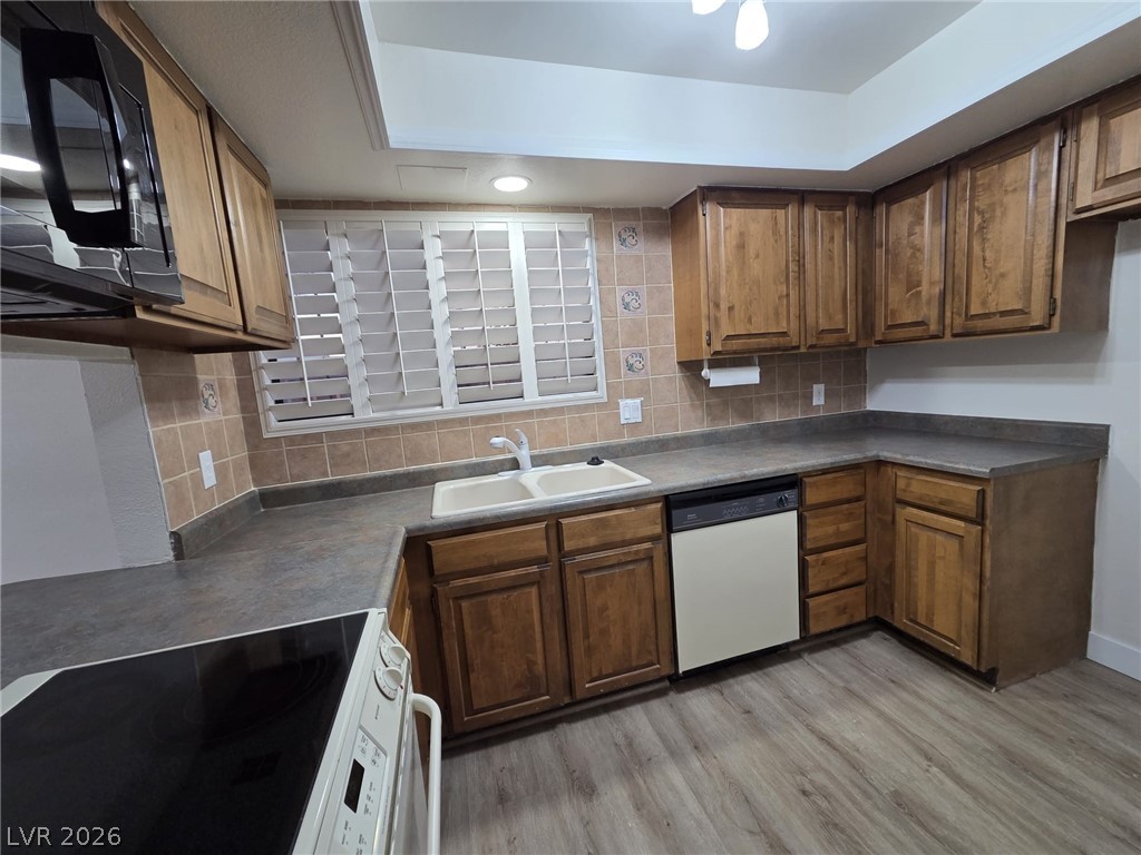 3317 Racquet Street Las Vegas, NV 89121 - Photo 15 of 23 This kitchen features ample cabinetry and a practical layout for everyday living.