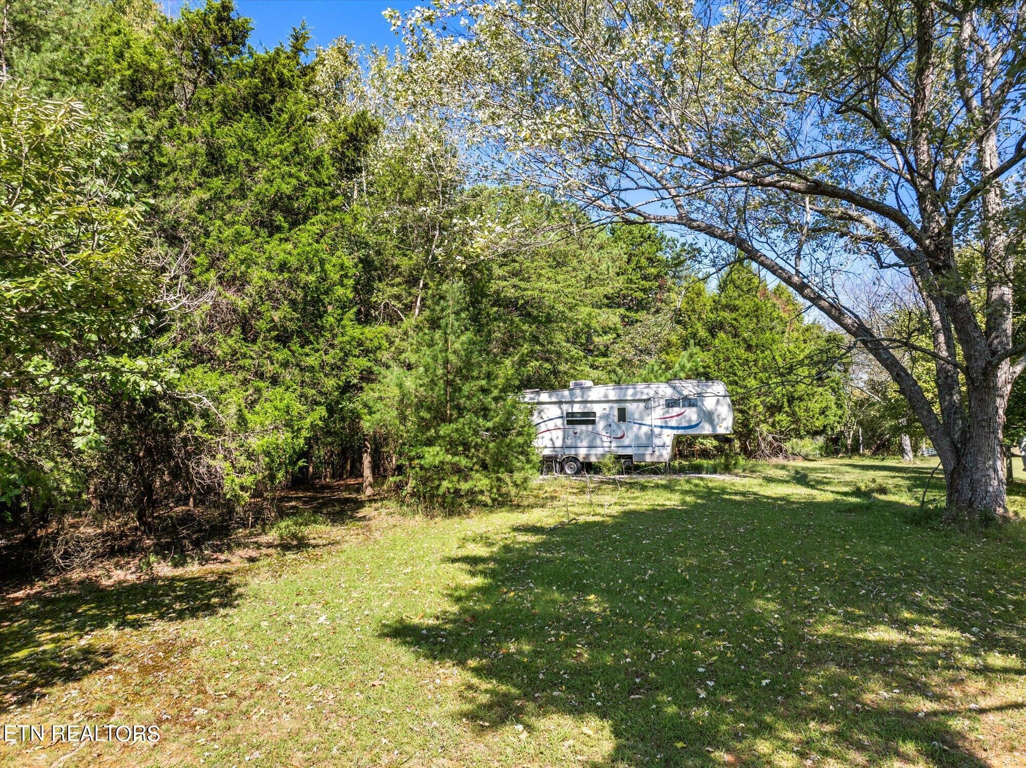 0 Pin Hook (lot 1) Rd Spring Spring City, TN 37381 - Photo 10 of 14 a backyard of a house with a yard and outdoor seating