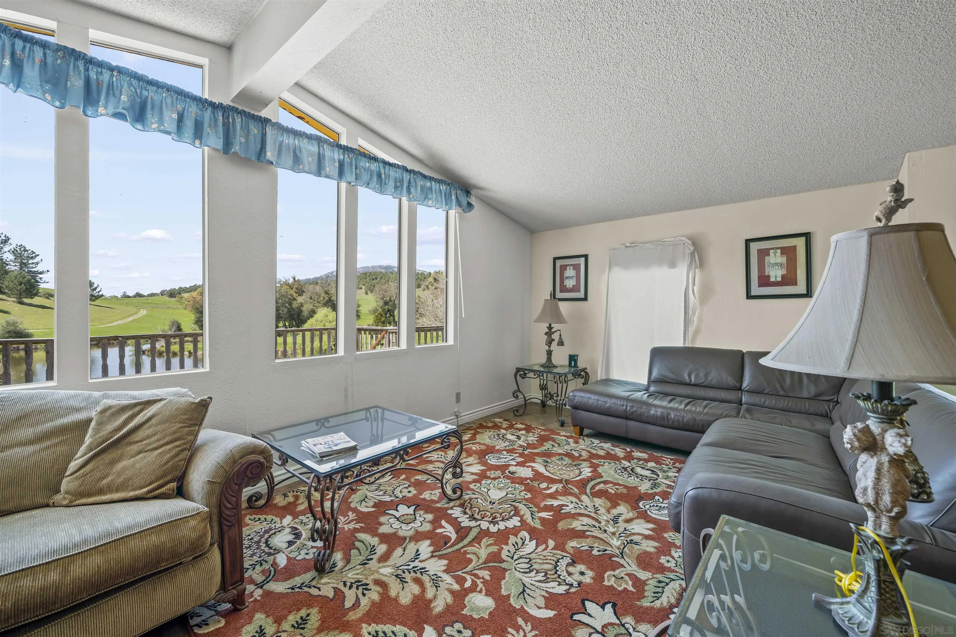 2464 Wynola Road Julian, CA 92036 - Photo 25 of 50 a living room with furniture and a large window