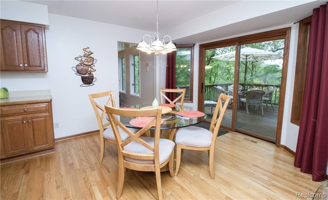 5770 Rochester Road Leonard, MI 48367 - Photo 13 of 54 Large eating area, room for additional small table plus small table & chairs around corner for playing cards.