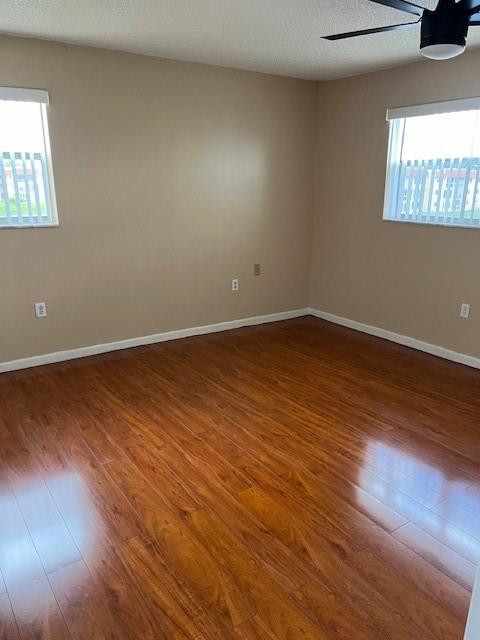 2811 North Pine Island Road, Unit 301 Sunrise, FL 33322 - Photo 3 of 4 an empty room with wooden floor and windows