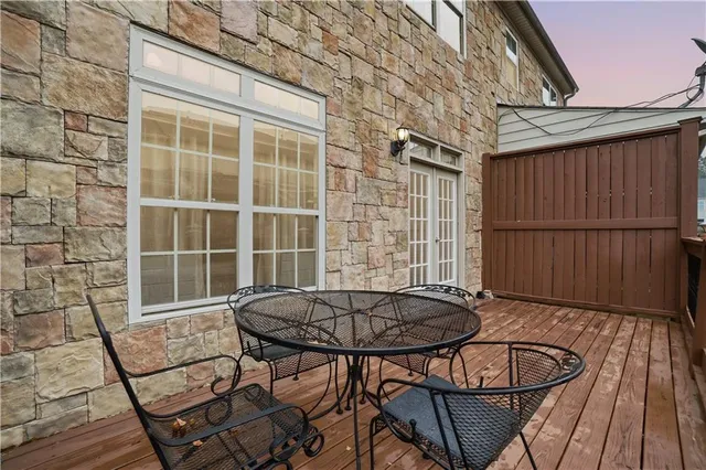 a view of a chairs and table in the patio