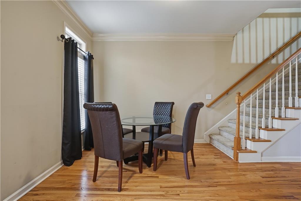 4414 George David Way Powder Springs, GA 30127 - Photo 14 of 29 a view of a hallway with wooden floor and stairs