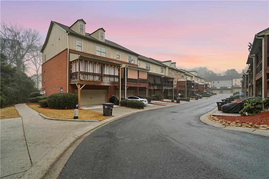 4414 George David Way Powder Springs, GA 30127 - Photo 27 of 29 a front view of a house with entertaining space