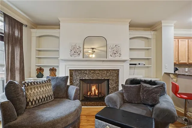 a living room with furniture and a fireplace