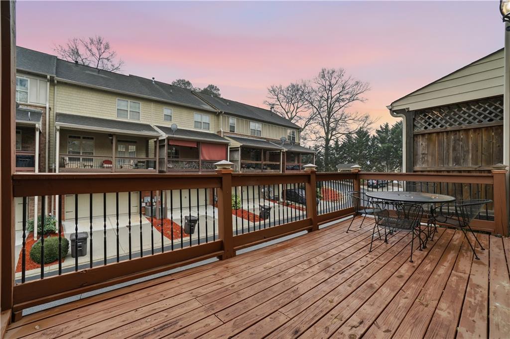 4414 George David Way Powder Springs, GA 30127 - Photo 10 of 29 a balcony with wooden floors and bench