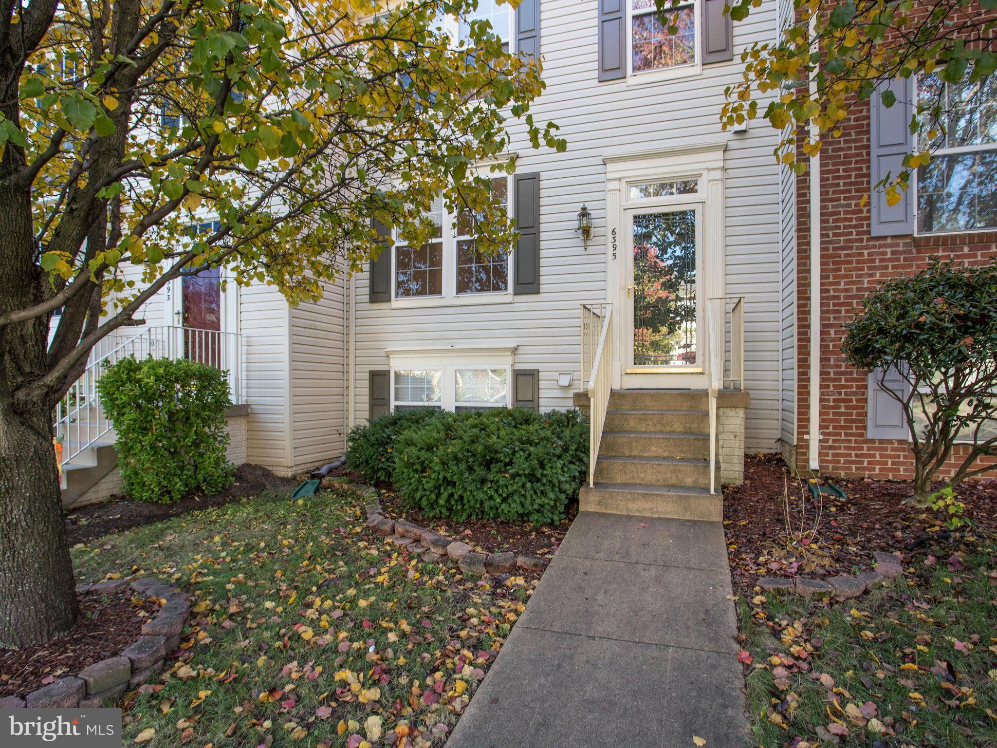 6395 Stagg Court Springfield, VA 22150 - Photo 1 of 30 a front view of a house with a garden