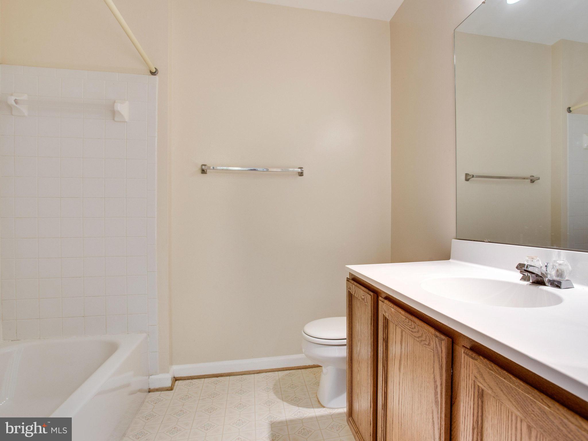 6395 Stagg Court Springfield, VA 22150 - Photo 22 of 30 a bathroom with a sink a toilet and vanity