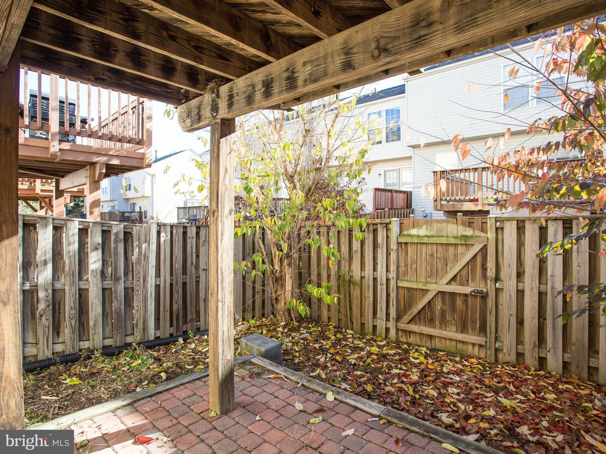 6395 Stagg Court Springfield, VA 22150 - Photo 26 of 30 a view of a pathway of a building with wooden fence
