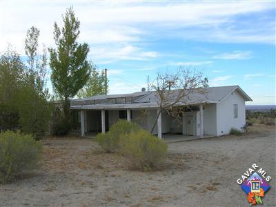 1101 Locust Road Pinon Hills, CA 92372 - Photo 2 of 2 a view of a house with a garden