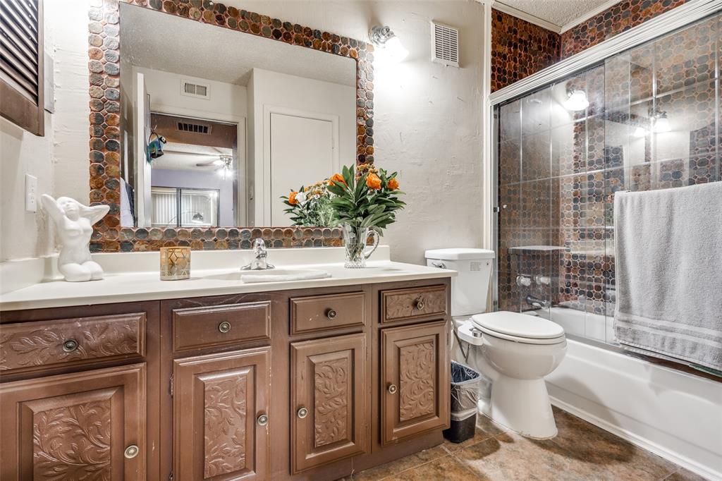 11470 Audelia Road, Unit 351 Dallas, TX 75243 - Photo 18 of 25 a bathroom with a toilet sink and mirror