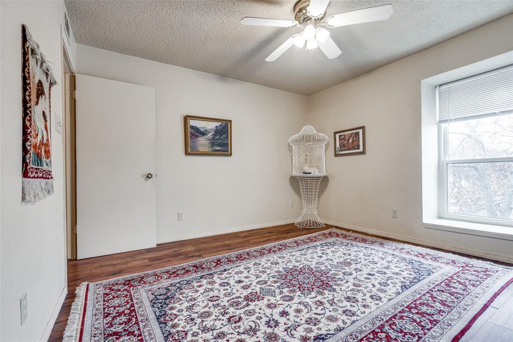 11470 Audelia Road, Unit 351 Dallas, TX 75243 - Photo 20 of 25 a view of an empty room with window and wooden floor