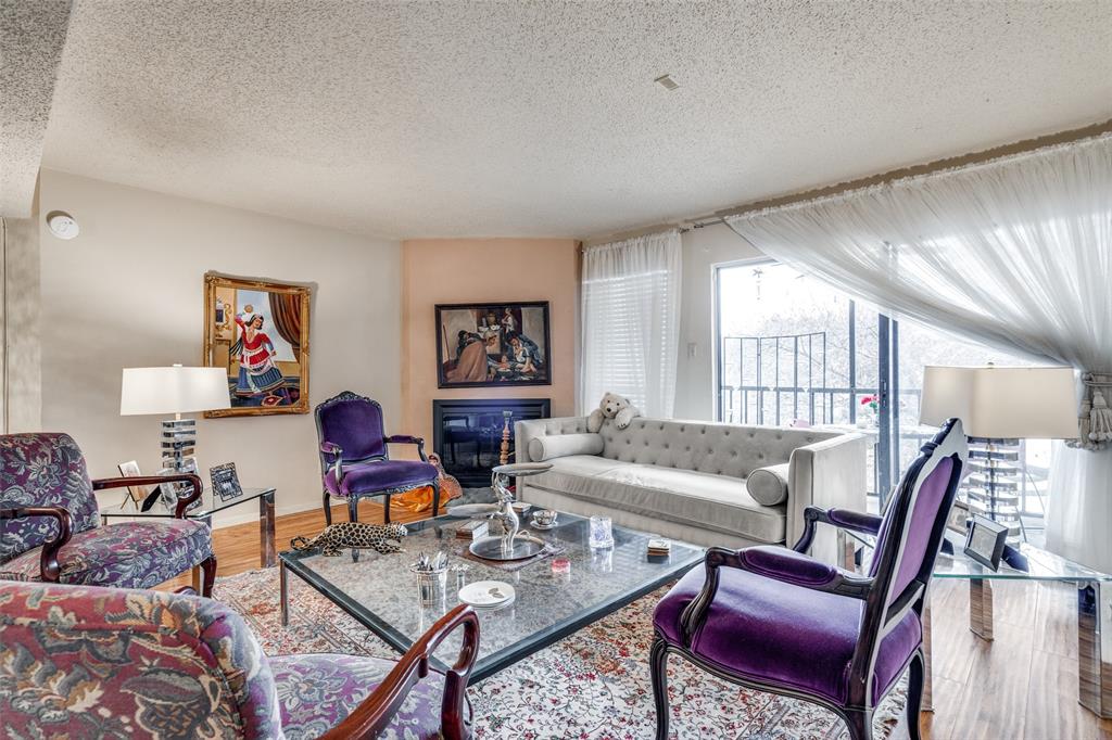 11470 Audelia Road, Unit 351 Dallas, TX 75243 - Photo 3 of 25 a living room with furniture a rug and a table