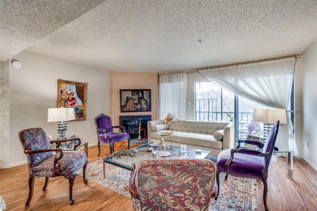 11470 Audelia Road, Unit 351 Dallas, TX 75243 - Photo 8 of 25 a living room with furniture and a wooden floor