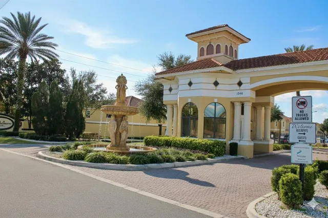 front view of a building with potted plants