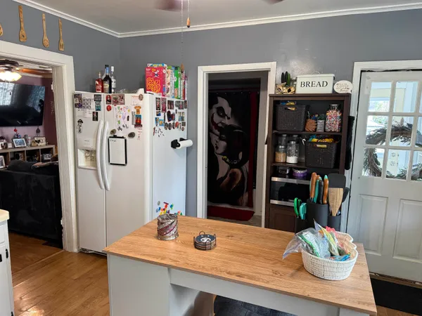 a view of kitchen island with furniture and wooden floor