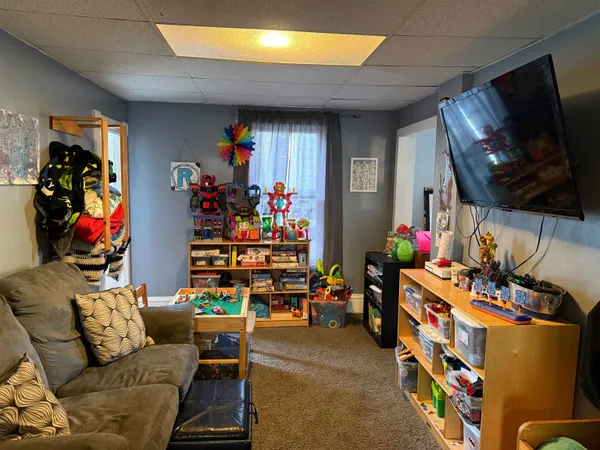 a room with toys and a flat screen tv