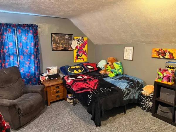 a bedroom with furniture and a couch