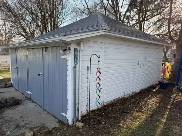 a view of a house with a wooden fence