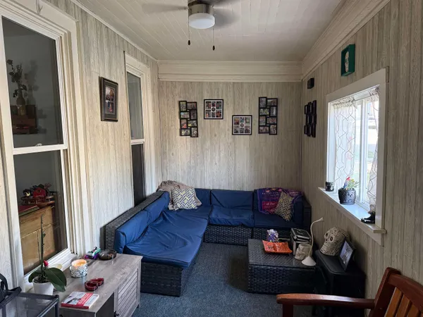 a living room with furniture and a window