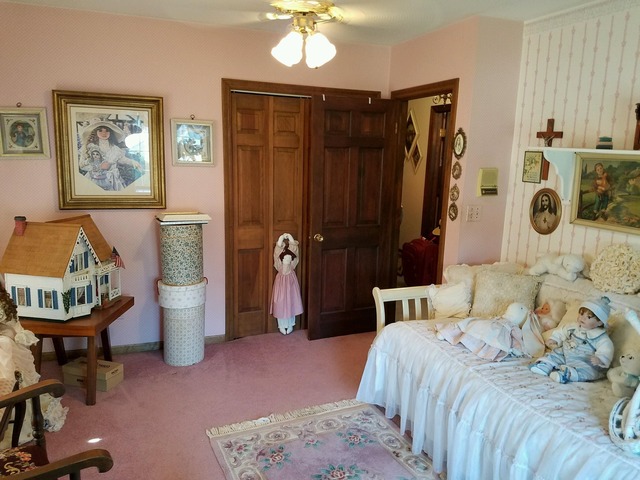 1619 Riverside Drive McHenry, IL 60050 - Photo 18 of 25 a bedroom with a bed and a mirror