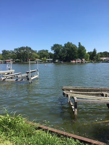 1619 Riverside Drive McHenry, IL 60050 - Photo 25 of 25 a view of a lake with houses in the back