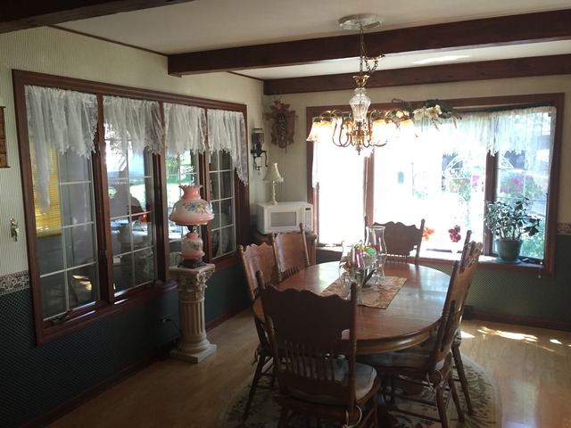1619 Riverside Drive McHenry, IL 60050 - Photo 3 of 25 a dining room with furniture a chandelier and window