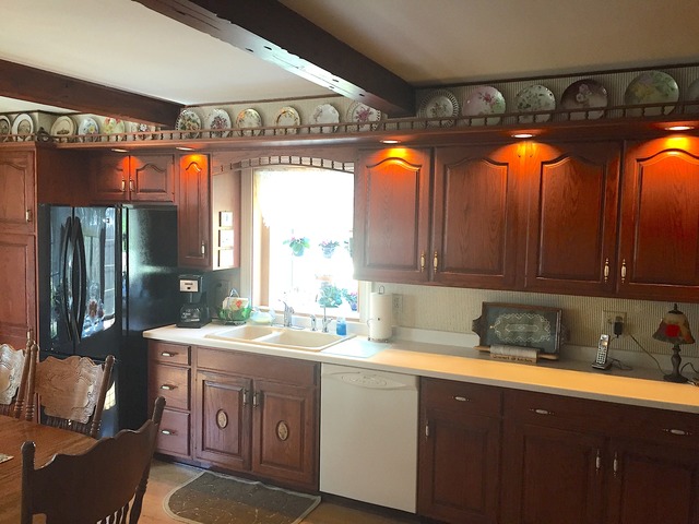 1619 Riverside Drive McHenry, IL 60050 - Photo 5 of 25 a kitchen with a sink window and cabinets