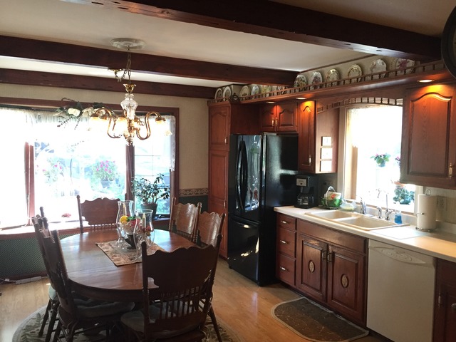 1619 Riverside Drive McHenry, IL 60050 - Photo 6 of 25 a view of a dining room with furniture window and outside view