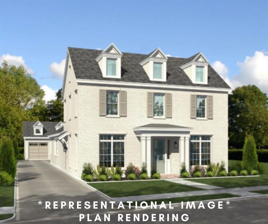 a front view of a building with a garden