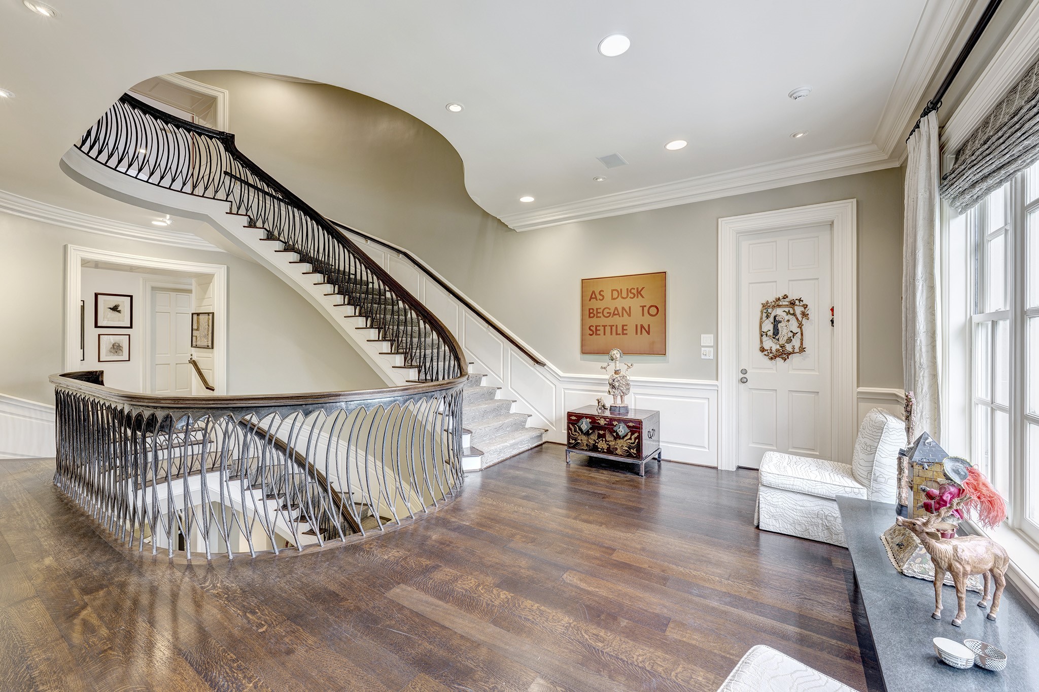 3653 Inverness Drive Houston, TX 77019 - Photo 21 of 39 The second-floor landing offers a delightful view of the staircase leading to the third floor. The hardwood flooring lends a rich feel, while the artistic iron staircase offers a lovely accent to the landing. The landing also allows access to the primary bedroom and other bedrooms on the second floor.