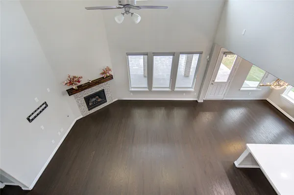 a view of a kitchen with a sink and a large window