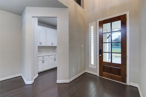 a view of staircase with white walls and a window