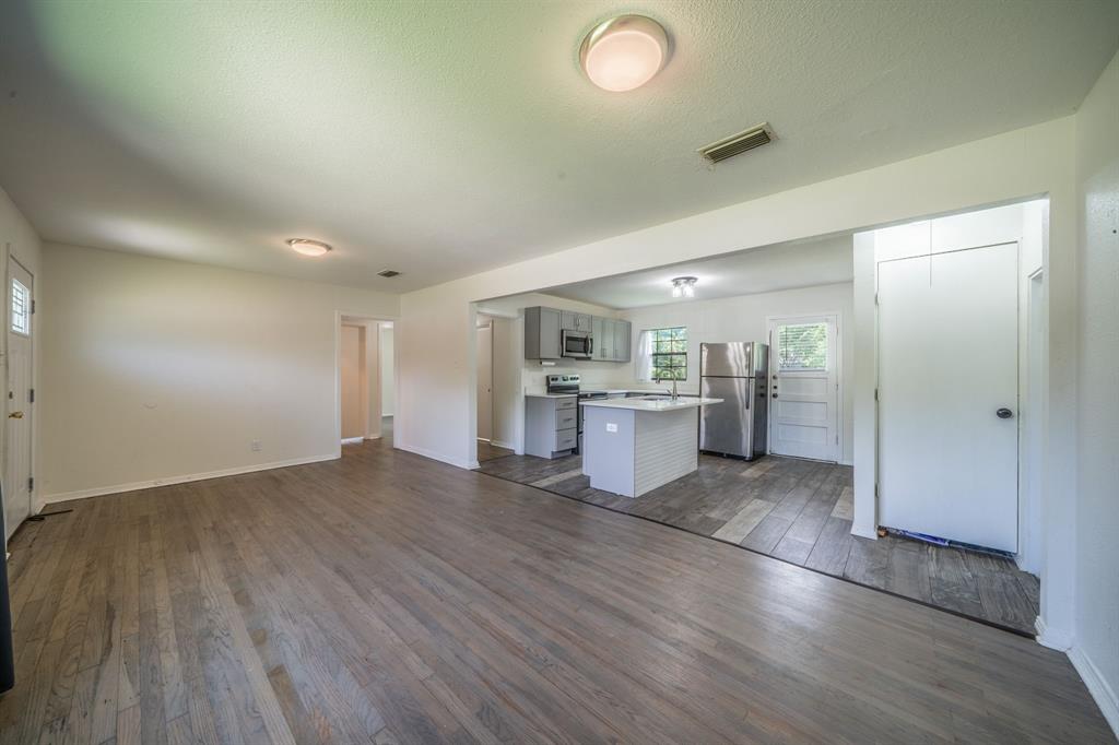11528 Sinclair Avenue Dallas, TX 75218 - Photo 4 of 16 Open concept living area featuring wood-finish flooring