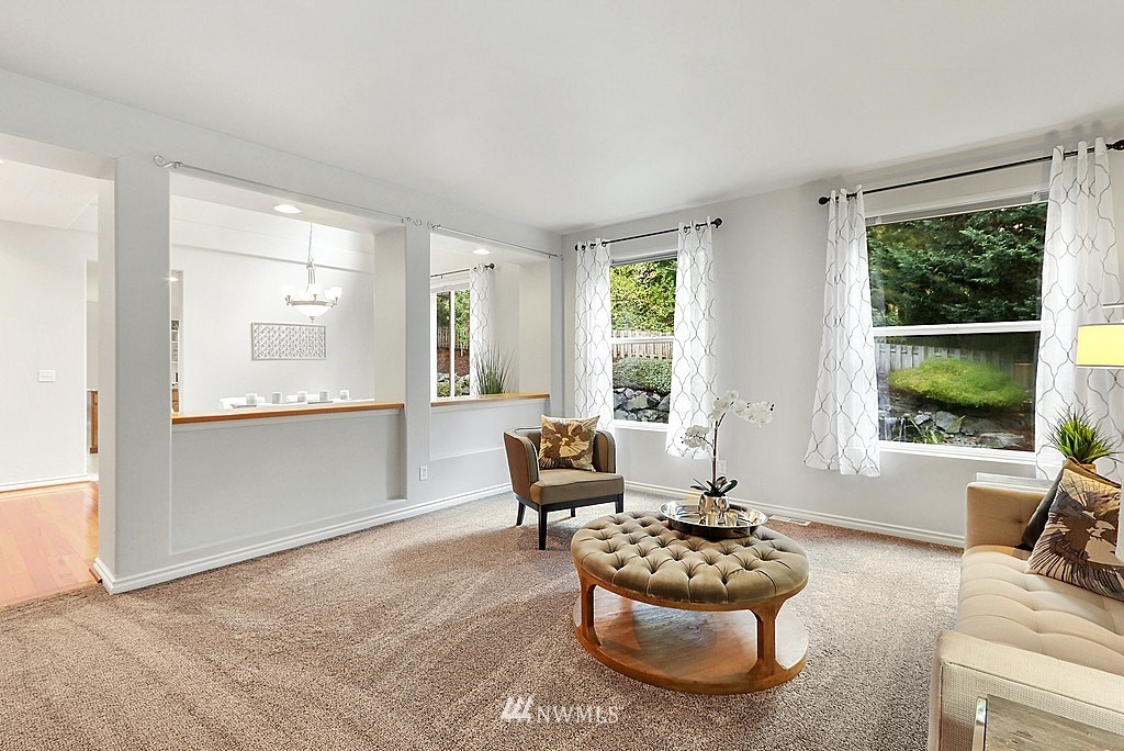 27714 Maple Ridge Way Southeast Maple Valley, WA 98038 - Photo 12 of 38 a living room with furniture and a large window