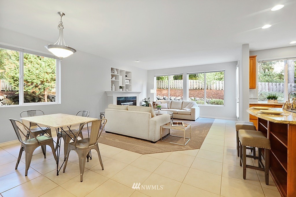 27714 Maple Ridge Way Southeast Maple Valley, WA 98038 - Photo 19 of 38 a dining room with furniture and a large window