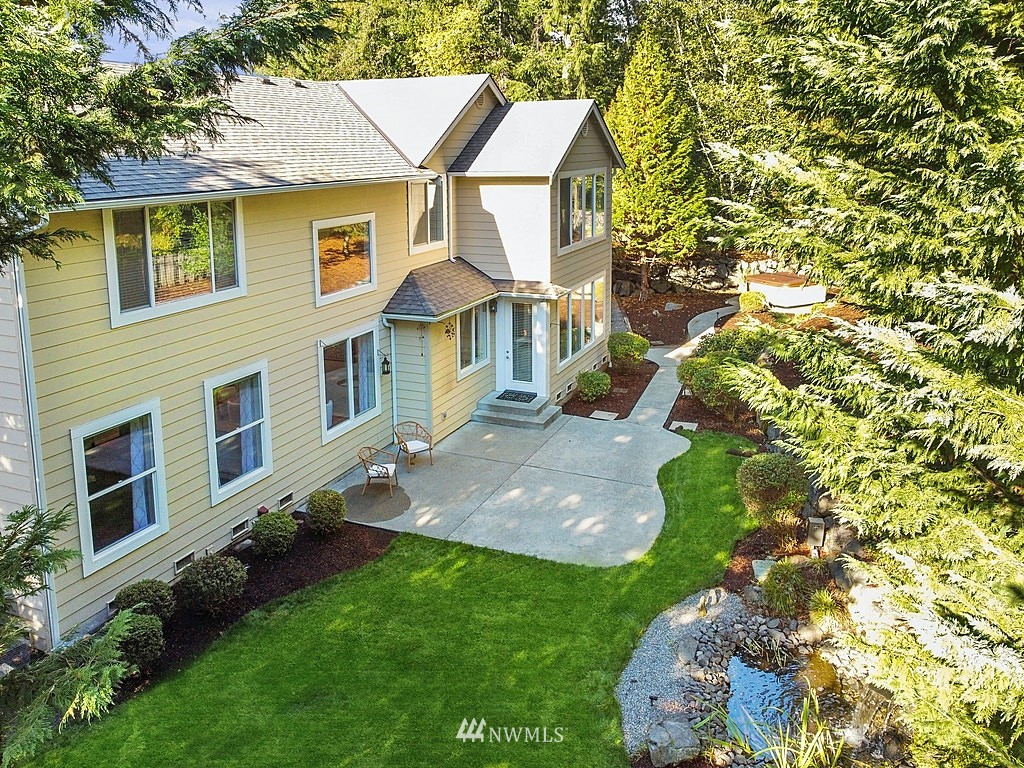 27714 Maple Ridge Way Southeast Maple Valley, WA 98038 - Photo 3 of 38 front view of a house with a yard