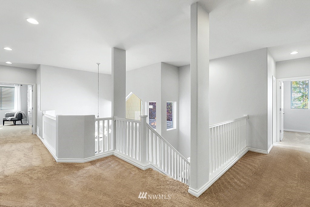 27714 Maple Ridge Way Southeast Maple Valley, WA 98038 - Photo 24 of 38 a view of a hallway with workspace and stairs