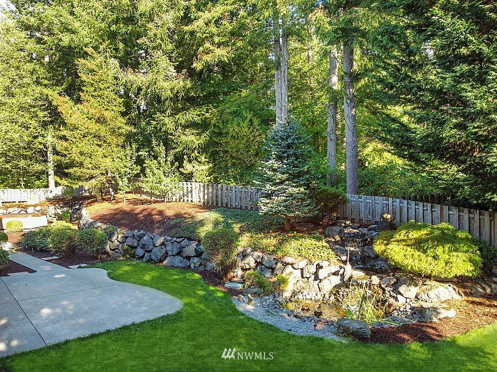 27714 Maple Ridge Way Southeast Maple Valley, WA 98038 - Photo 4 of 38 a view of a backyard with swimming pool