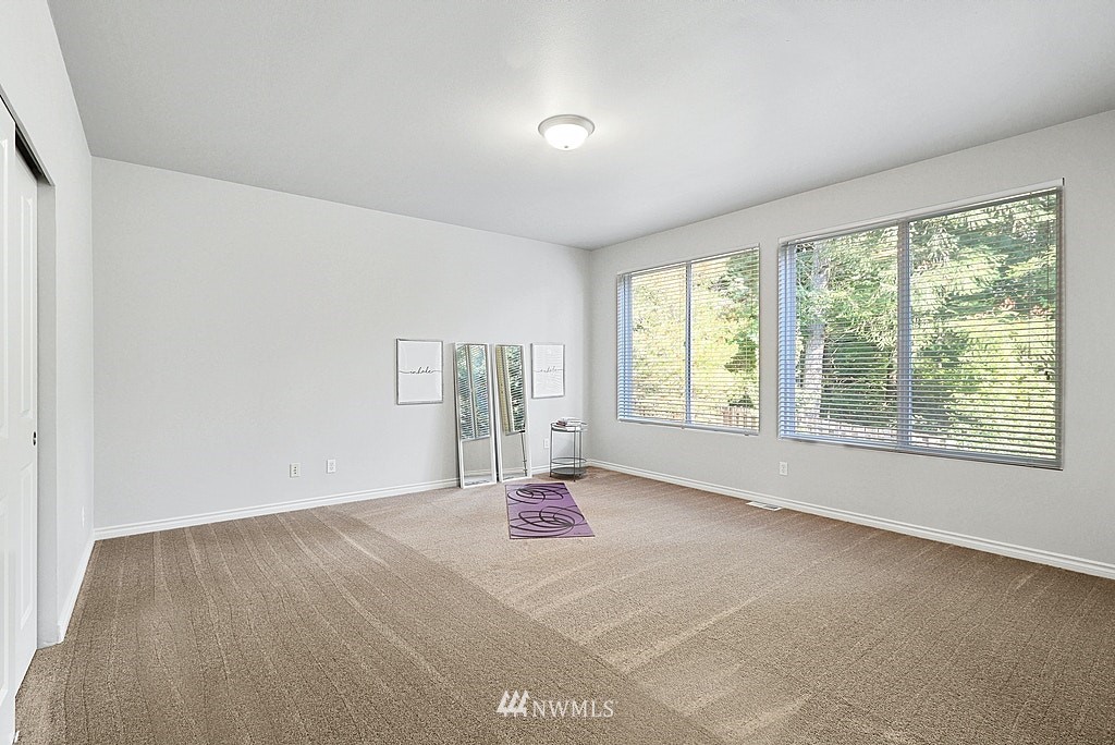 27714 Maple Ridge Way Southeast Maple Valley, WA 98038 - Photo 31 of 38 a view of an empty room with a window