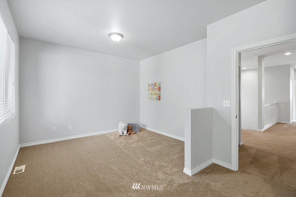 27714 Maple Ridge Way Southeast Maple Valley, WA 98038 - Photo 33 of 38 an empty room with a window