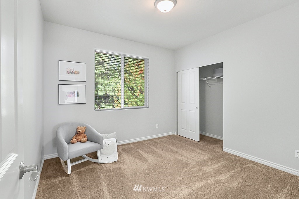 27714 Maple Ridge Way Southeast Maple Valley, WA 98038 - Photo 35 of 38 a view of a room with lounge chair and a window