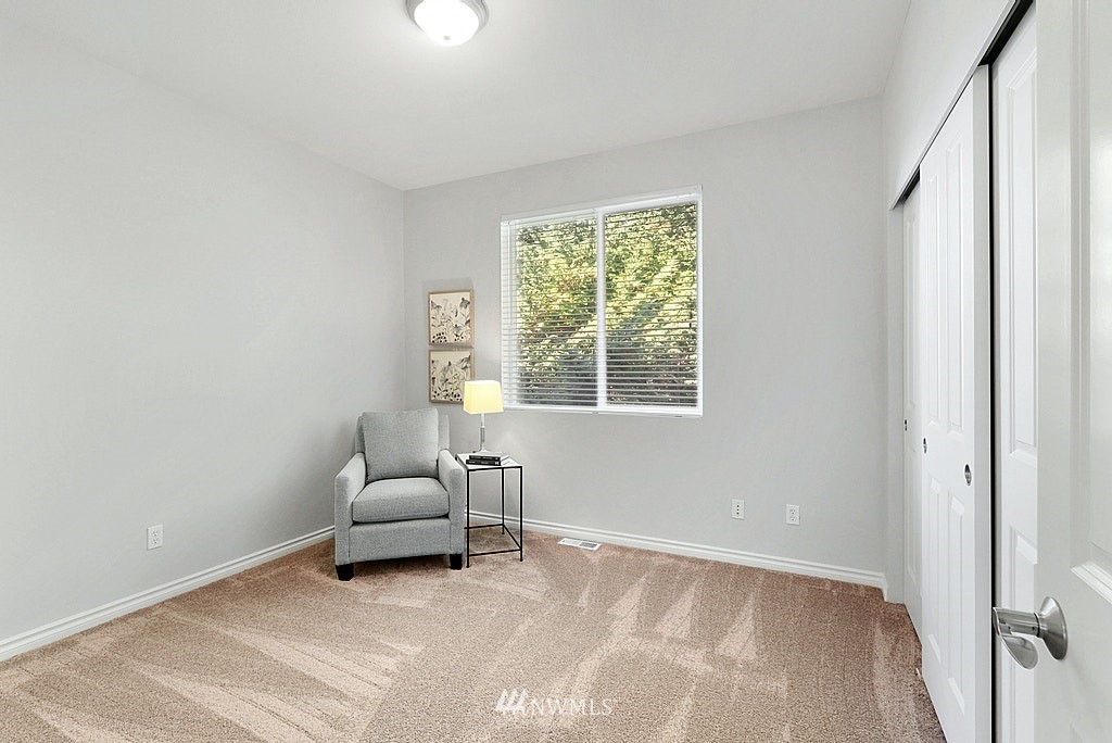 27714 Maple Ridge Way Southeast Maple Valley, WA 98038 - Photo 36 of 38 a living room with furniture and a window