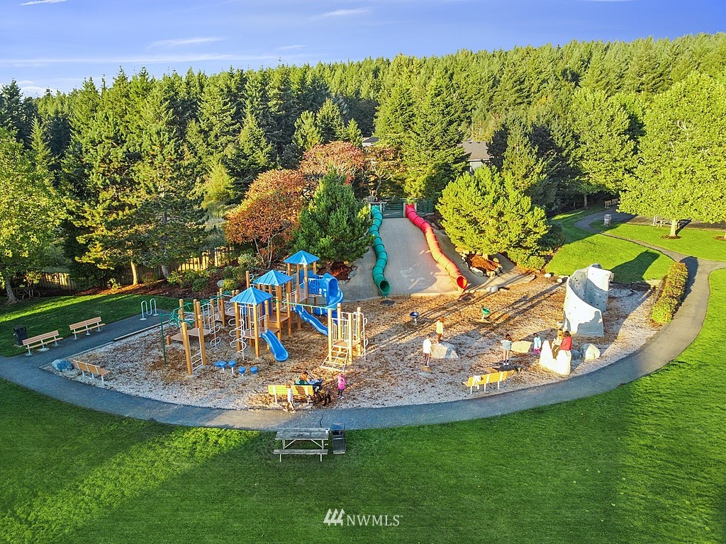 27714 Maple Ridge Way Southeast Maple Valley, WA 98038 - Photo 38 of 38 a view of a swimming pool with a yard