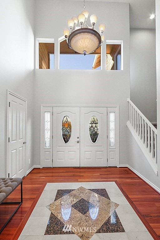 27714 Maple Ridge Way Southeast Maple Valley, WA 98038 - Photo 9 of 38 a view of a bedroom with furniture and wooden floor